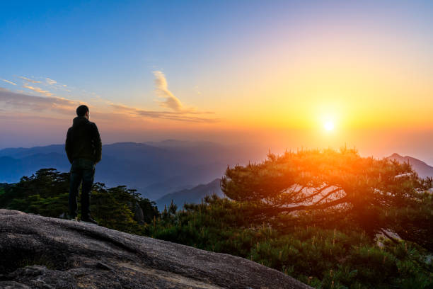 istock Man on top of mountain,conceptual scene 1151102089
