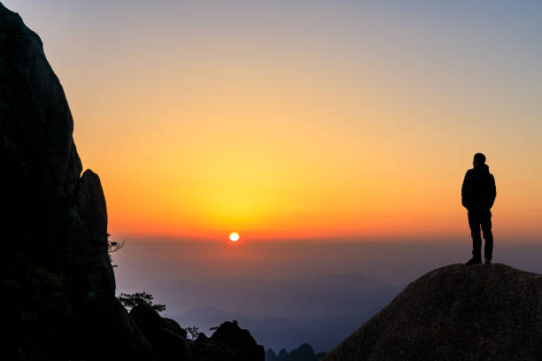 Man on top of mountain,travel concept scene