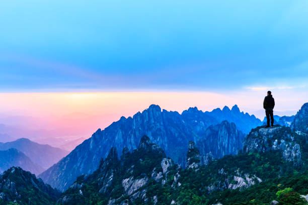 Man on top of mountain,travel concept scene