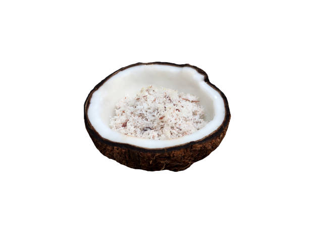 istock Halve old coconut with meat slice inside isolated on white background. 1151104640