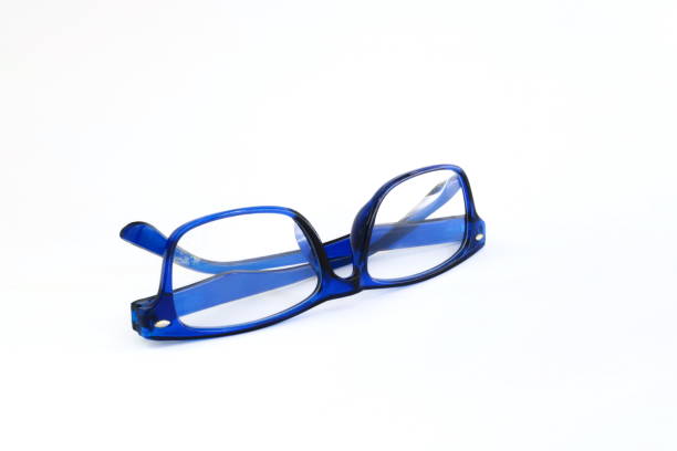 istock Close-up of blue glasses on white background. 1151106120