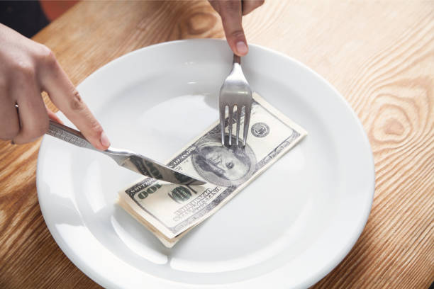 istock Hundred dollars on a plate. Cuts a dollars 1151106270