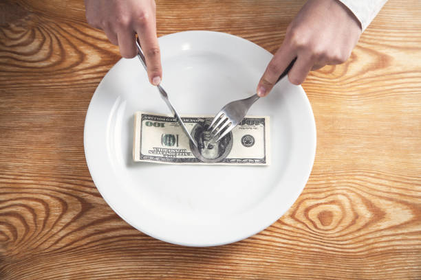 istock Hundred dollars on a plate. Cuts a dollars 1151106292