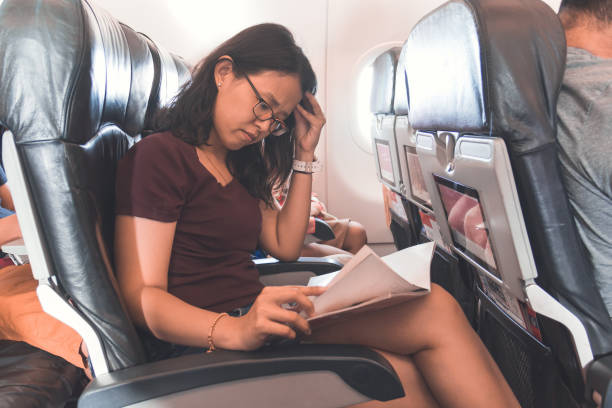 istock Asian woman in airplane 1151108218