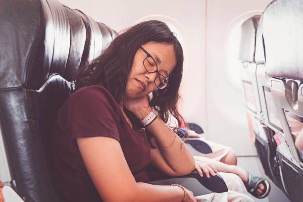 istock Asian woman in airplane 1151108230