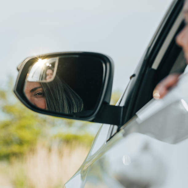 istock Young woman enjoying spring with her car 1151109110