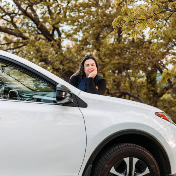 istock Young woman enjoying spring with her car 1151110163