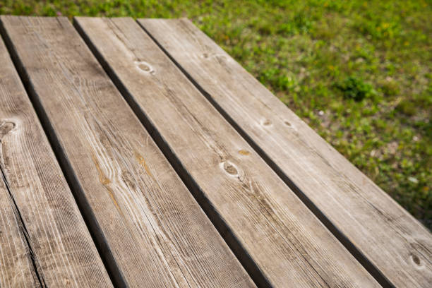 Wood texture background. Rustic pine Picnic table.  Weathered knotted pine wood.