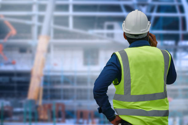 istock The engineer standing orders for construction crews to work on blurred site background. Industry and safety ideas concept. 1151111818