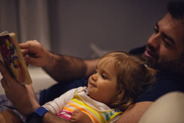 istock Enjoying her bed time story 1151111880