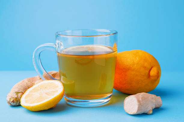 istock Tea, lemon and ginger on a blue background 1151112753
