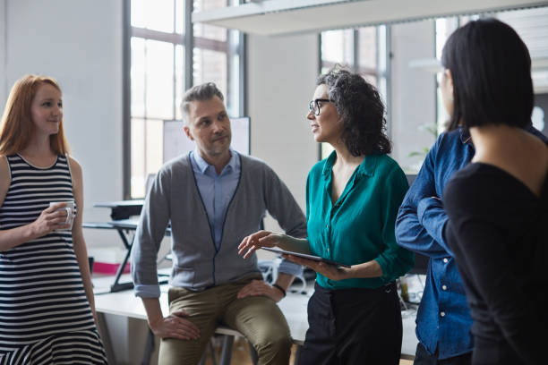 istock Standing up business meeting in a startup office. 1151114467