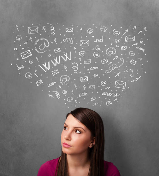 istock Young woman thinking with social network icons above her head 1151114779