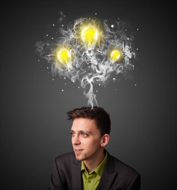 istock Thoughtful businessman with smoke and lightbulbs above his head 1151115641
