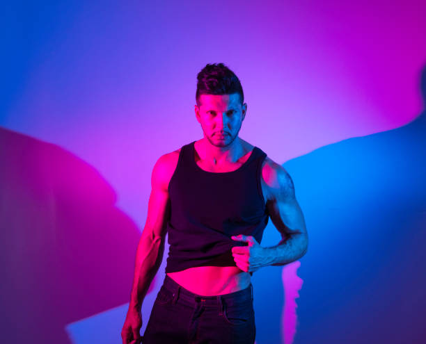 istock Handsome latino man in front of colorful wall 1151115907