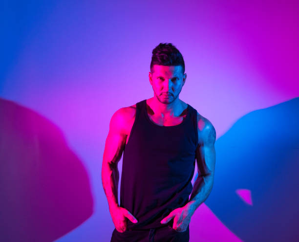 istock Handsome latino man in front of colorful wall 1151115933