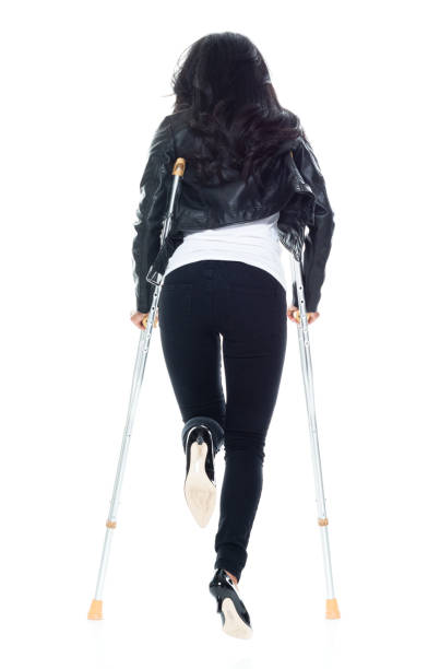 bautiful woman wearing a leather jacket and using crutches - 11193 imagens e fotografias de stock