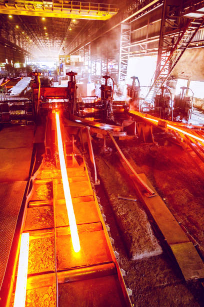 Steel Bars been shaped at a Large Steel Factory in Africa Steel, Factory, Business, Industry, Africa - Deformed bars been shaped at a large steel factory in Africa rebar production stock pictures, royalty-free photos & images