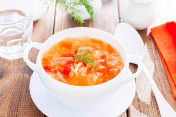 istock vegetable soup with onions and cabbage for onion diets in a white bowl, horizontal 1151117066