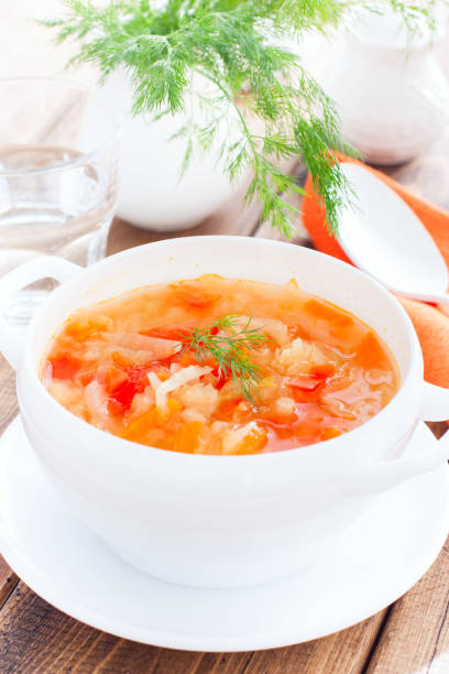 istock vegetable soup with onions and cabbage for onion diet in a white bowl, selective focus 1151117100