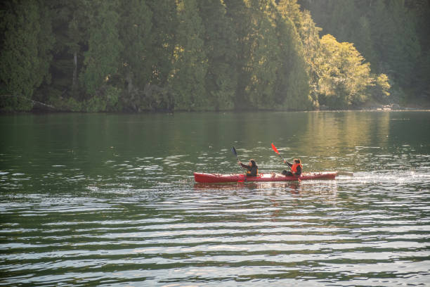 istock Multi-Ethnic Mother and Daughter Kayaking in Ocean Inlet, Canada 1151117150