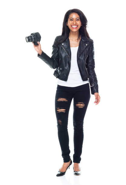 istock Bautiful woman wearing a leather jacket sitting and using a DSLR camera 1151117302