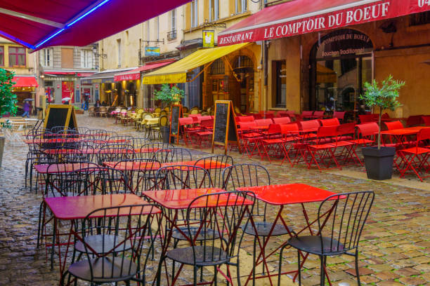 French restaurant with tables and chairs on the street of Paris, France