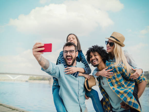 istock Group of friends making selfie 1151119035
