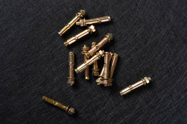 istock top view several expansion bolts on a dark background 1151121044