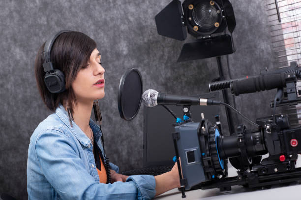 istock pretty young woman video editor working in studio 1151122178