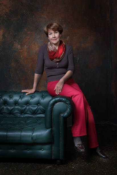 istock A middle aged woman in red pants 1151124536