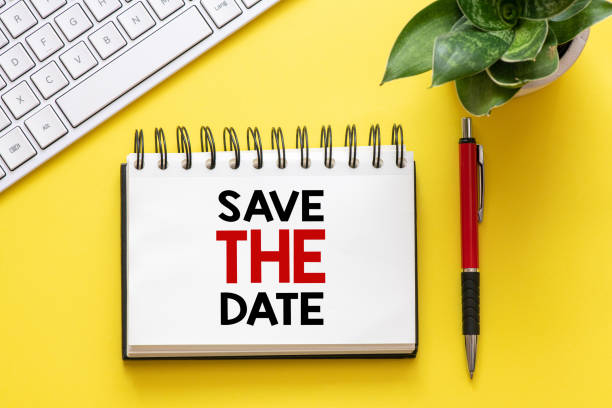 istock Word text Save the date on white paper on office table / business concept 1151125554