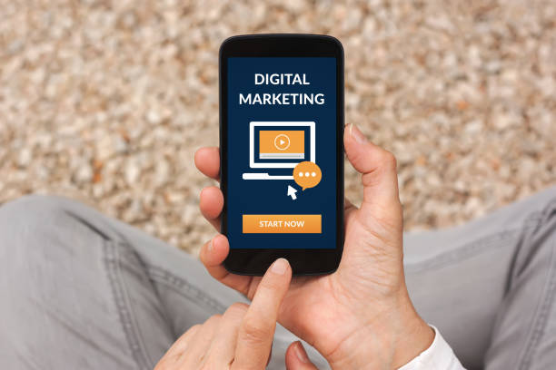 istock Hands holding smart phone with digital marketing concept on screen 1151126771