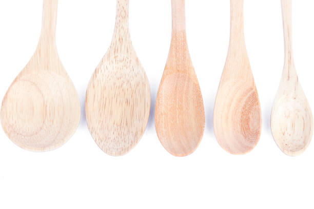 istock Close-Up Of Spoons Over White Background 1151131402