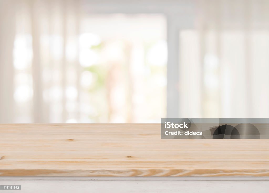Empty table top on blurred view through abstract curtained window Table Stock Photo