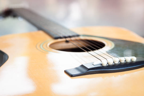 istock Close-Up Of Guitar On Table 1151133761