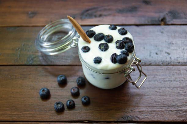 istock Blueberries in fresh organic yogurt in glass 1151134287