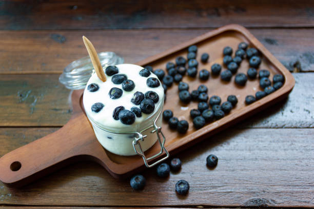 istock Blueberries in fresh organic yogurt in glass 1151134401