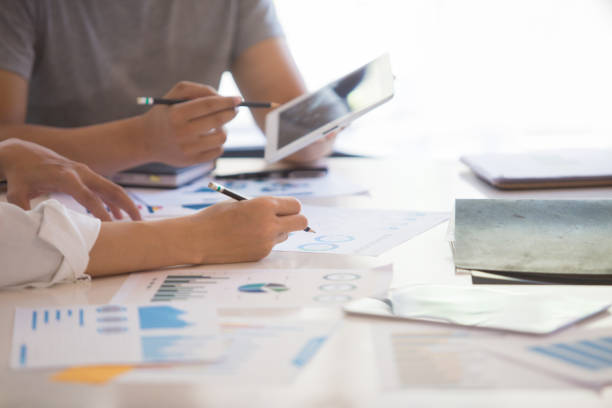 istock Business group or business partners discussing documents and ideas at meeting 1151134515