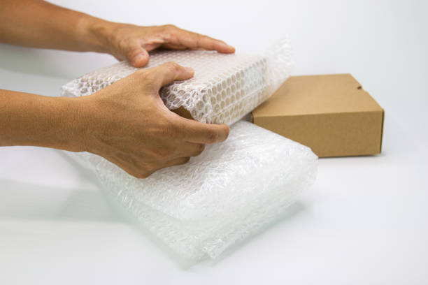 istock hand of man hold bubble pack, for protection parcel product cracked 1151134534