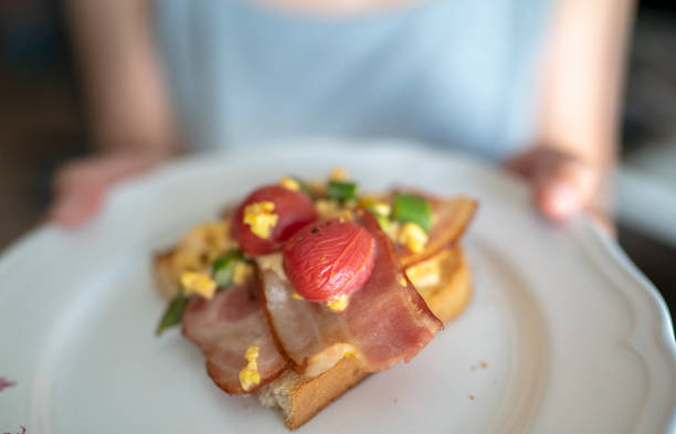 istock homemade healthy breakfast: toasted bread with bacon and egg 1151137862