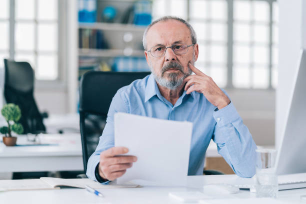 istock A senior businessman working in his modern office 1151138051