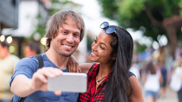istock Young couple making a selfie on the street 1151138651