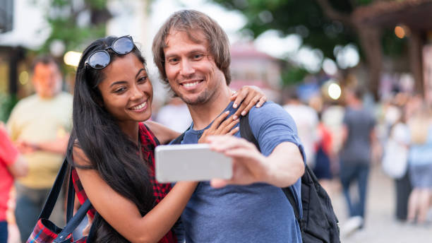 istock Young couple making a selfie on the street 1151138652