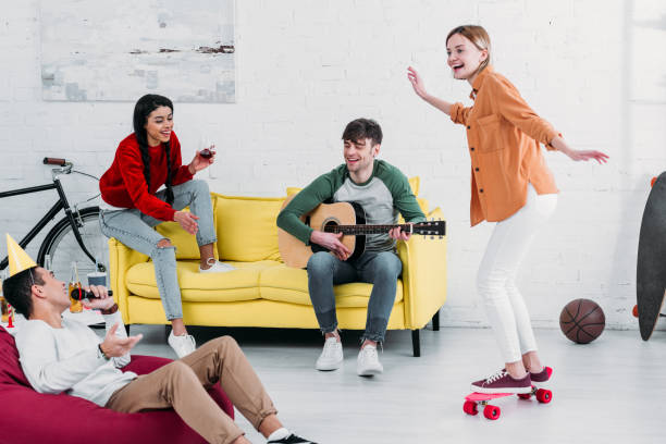 istock multicultural friends having fun at home in spacious living room 1151139966