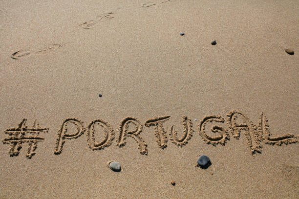 istock hashtag written by hand in the sand 1151140662
