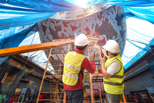 review jobs - crane shipyard construction pulley imagens e fotografias de stock