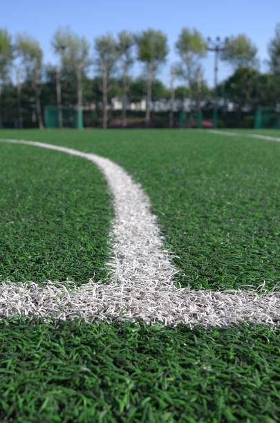 istock White line on a artificial lawn of small soccer playground 1151140811
