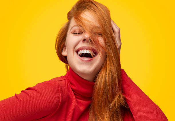 istock Laughing model touching ginger hair 1151141538