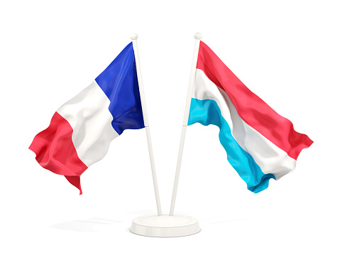 Two waving flags of France and luxembourg isolated on white. 3D illustration